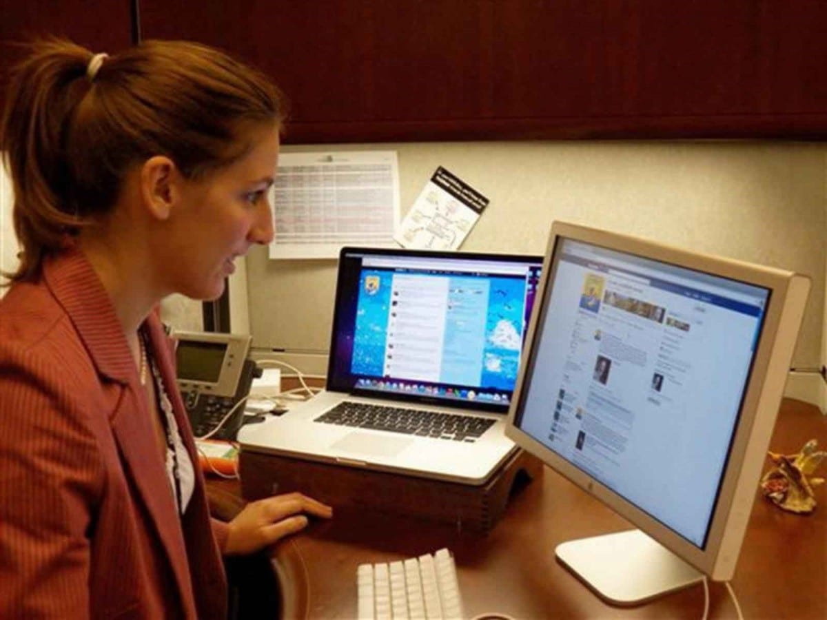 an employee checks on social media at work