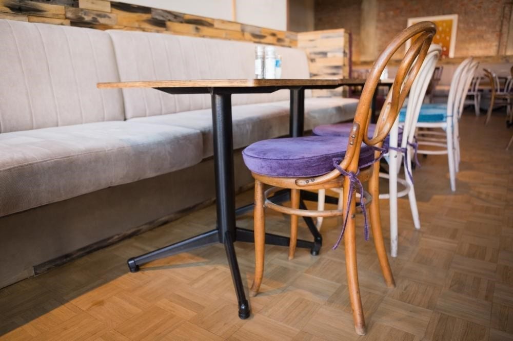 Coffee Shop with a table and purple chair.