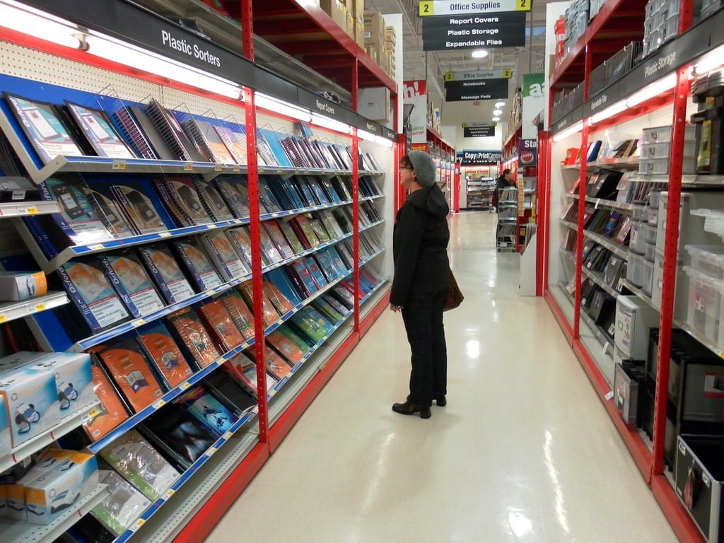 woman checking products in a retail store