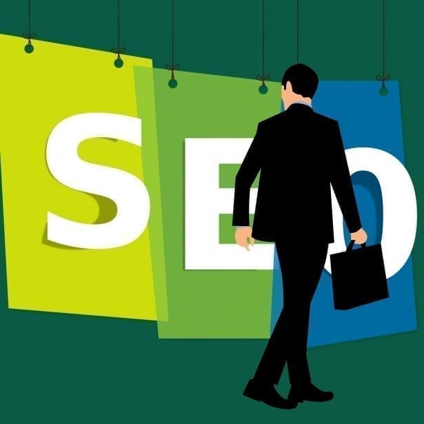 Man with a briefcase looking at SEO.